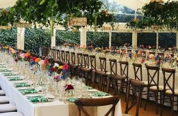 Crossback chairs, long trestle tables and Reserva glassware with ivory linen