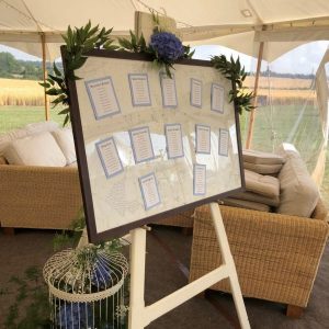 White wooden easel with table plan
