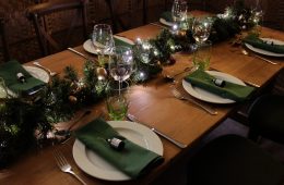 Rustic Christmas trestle table with green napkins