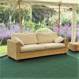 Beige rattan 3 seater sofas with ivory cushions