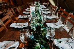 Rustic wedding setting with foliage runners and Savoie glassware